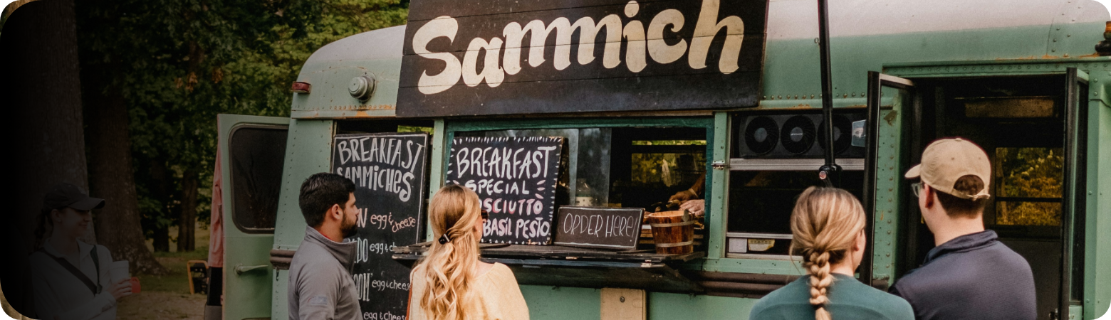People ordering at a food truck